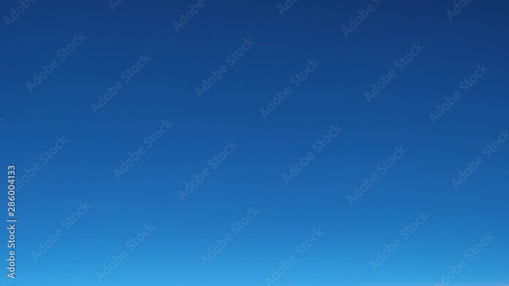 Beautiful white clouds on gradient dark blue sky in the morning through airplane view video Beautiful white clouds on gradient dark blue sky in the morning through airplane view video