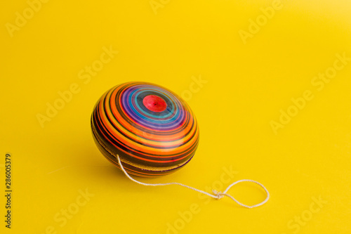 Tableau sur toile mexican toys, yoyo from Wooden in Mexico on yellow background