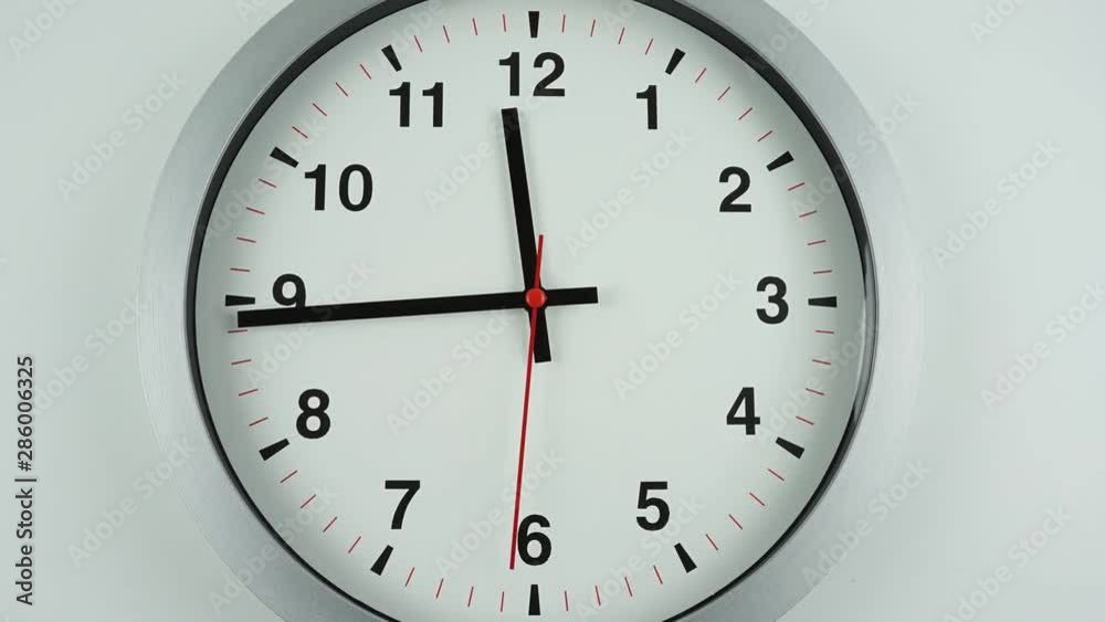 Closeup Zoom out, Gray clock beginning of time 11.45 am or pm, Time lapse 45 minutes moving fast on white background. Closeup Zoom out, Gray clock beginning of time 11.45 am or pm, Time lapse 45 minutes moving fast on white background.