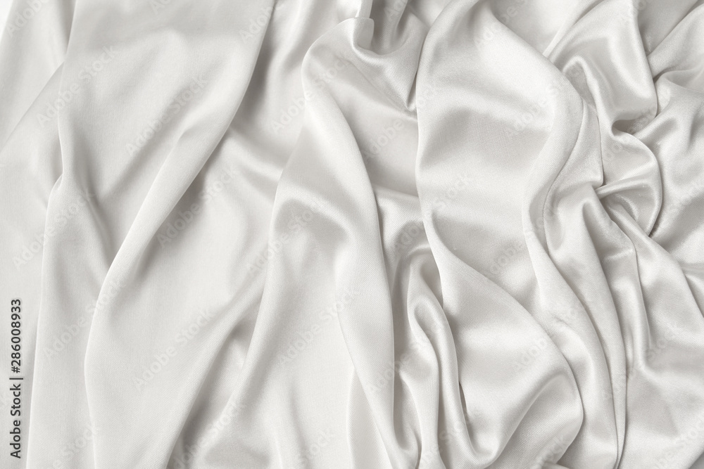 Obraz premium silk knitted fabric softly draped with small folds, texture, background, form for postcard, copy space