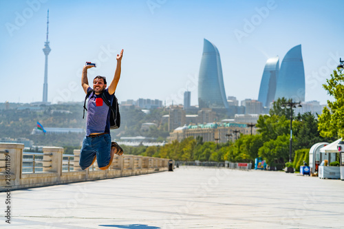 happy tourist take selfie photo in Baku, Capital of Azerbaijan. Travelling in Caucasus country