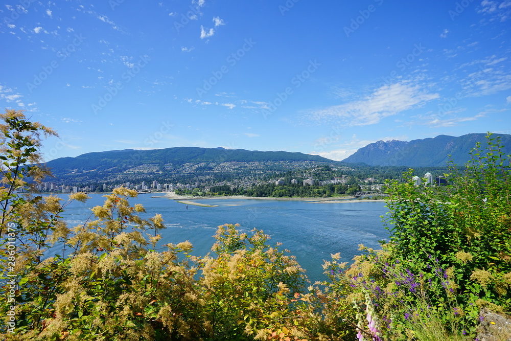 Beautiful Vancouver bay beach and mountain seen from Stanley park	