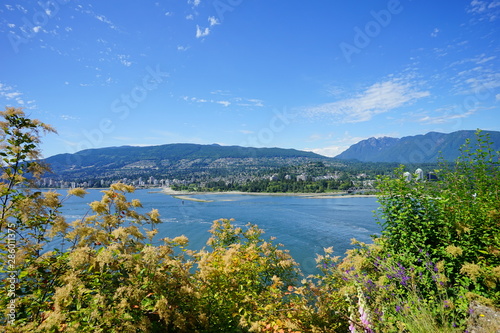 Beautiful Vancouver bay beach and mountain seen from Stanley park 
