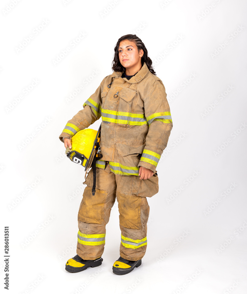 Female American firefighter in her gear Female American firefighter in her gear