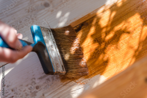 Paint the porch with orange paint. Decorate the terrace. Paint the boards with a wide brush. To make repairs.
