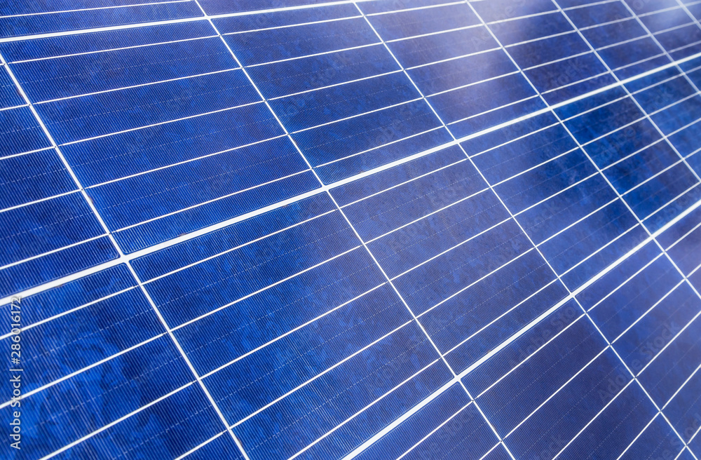 Close up rows array of Solar panels or solar cells or photovoltaics in solar power station is power production technology renewable green clean energy energy efficiency from the sun Close up rows array of Solar panels or solar cells or photovoltaics in solar power station is power production technology renewable green clean energy energy efficiency from the sun