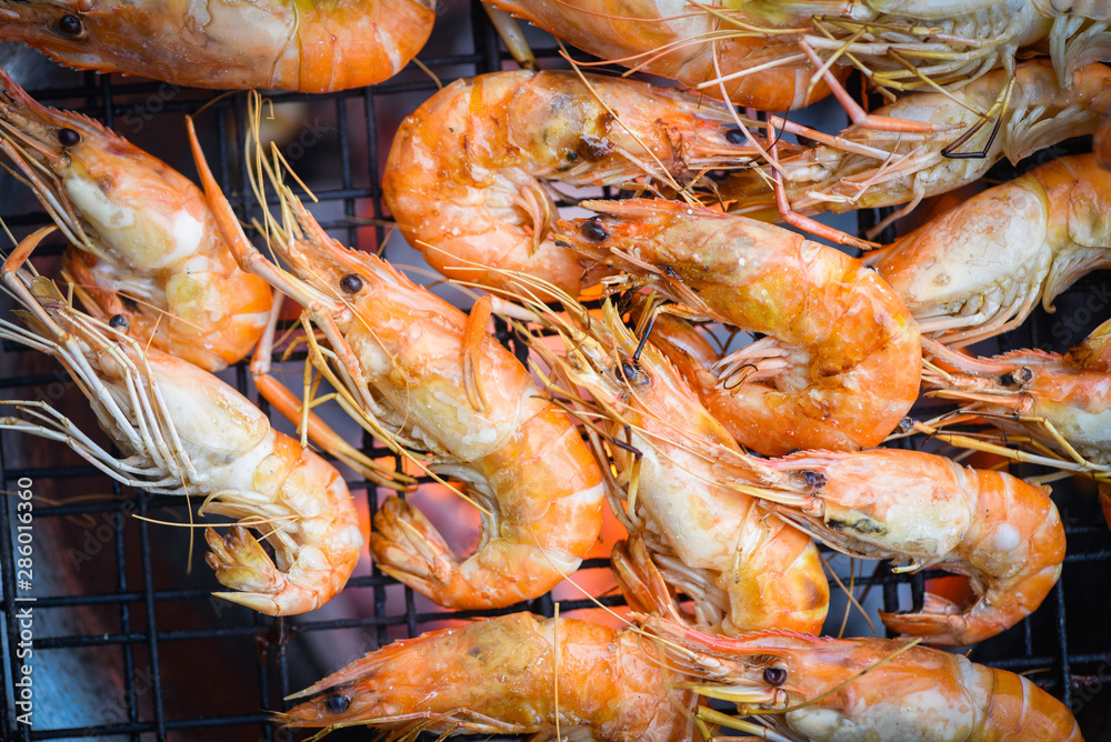 shrimp grilled bbq seafood on stove - prawns shrimps cooked burnt on grill barbecue shrimp grilled bbq seafood on stove - prawns shrimps cooked burnt on grill barbecue