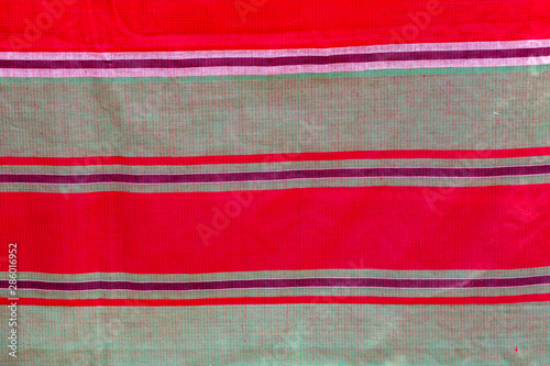 Green, red and white strip cotton Gamcha(Bath towel) Fabrics Close-up. photo