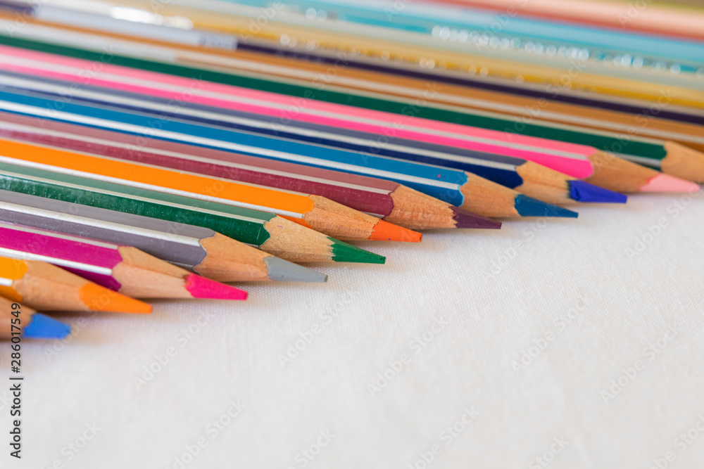 Fototapeta premium colored pencils and white background