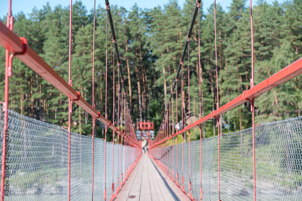 bridge over a mountain river. metal big bridge. Look at the river from above. stand over the river on the bridge. view from the bridge to the mountains. Mountain landscape. bridge over a mountain river. metal big bridge. Look at the river from above. stand over the river on the bridge. view from the bridge to the mountains. Mountain landscape.