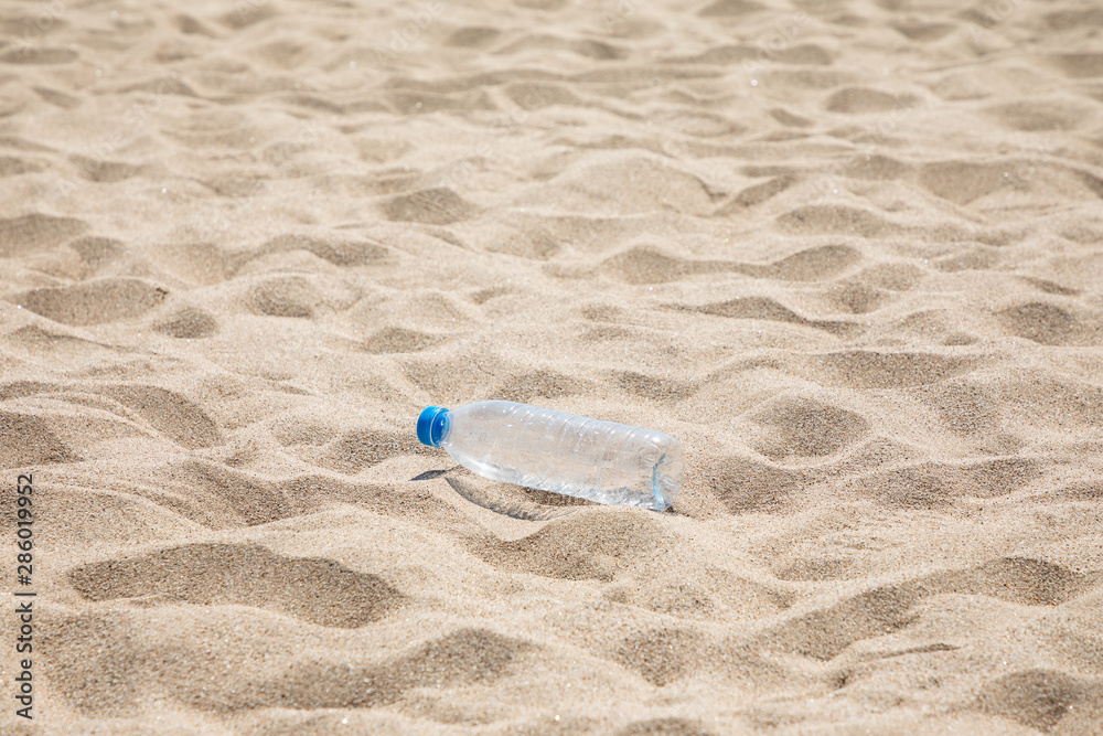 Empty plastic bottle at the beach Empty plastic bottle at the beach