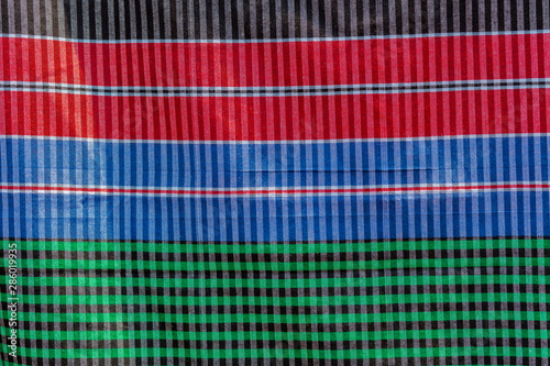 Green, red, blue and black strip cotton Gamcha(Bath towel) Fabrics Close-up. photo