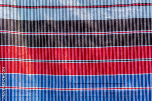 Green, red, blue and black strip cotton Gamcha(Bath towel) Fabrics Close-up. photo