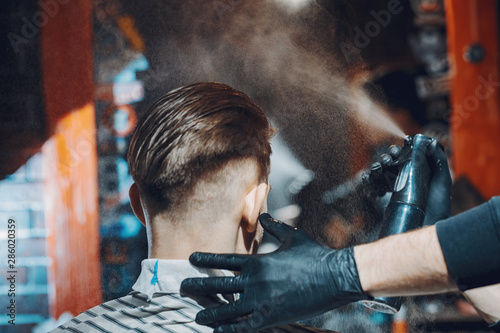 Man with a beard. Hairdresser with a client.