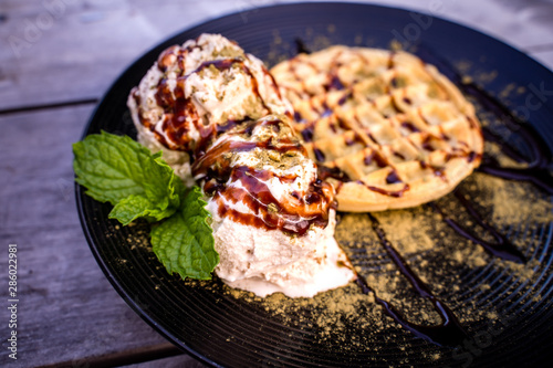 Matcha green tea topping on ice cream with waffle and Chocolate 