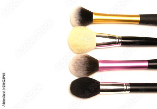 a set of brushes for makeup in different colors
