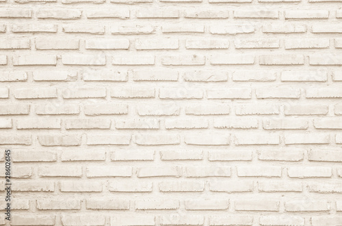 Wall cream brick wall texture background in room at subway. Brickwork stonework interior  rock old clean concrete grid uneven abstract weathered bricks tile design  horizontal architecture wall.