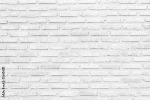 Wall white brick wall texture background in room at subway. Interior rock old clean uneven tile design  horizontal architecture wall.