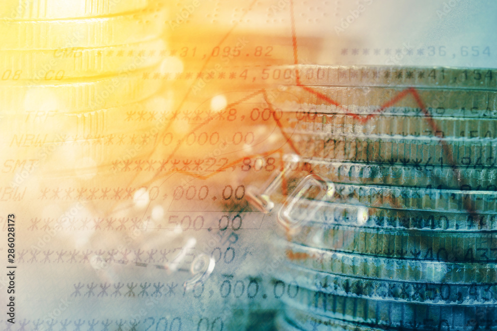 Obraz premium double exposure of coins and book bank with graph for business and finance background