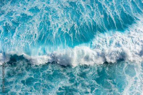 Beautiful sea waves with foam of blue and turquoise in bali,Indonesia.