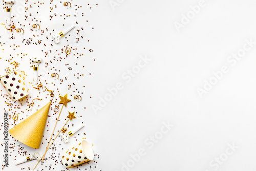 Celebration background - party accessories in golden colors. Copy space. © dil_ko