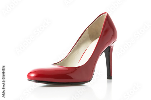 Red color high heel fashion shoe on background