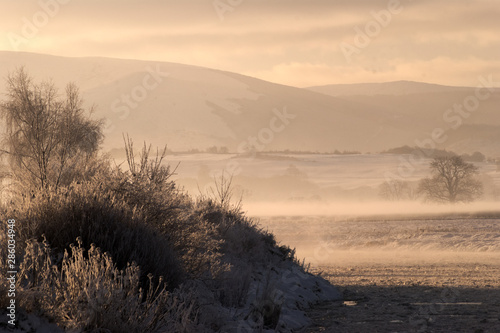 Cold winter scene over the River Nith with Criffel hill in the background. Dumfries, Scotland.