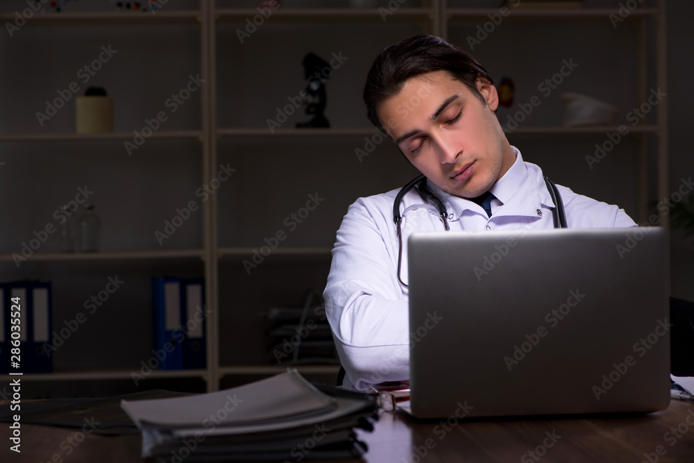 Young male doctor in the hospital at night Young male doctor in the hospital at night