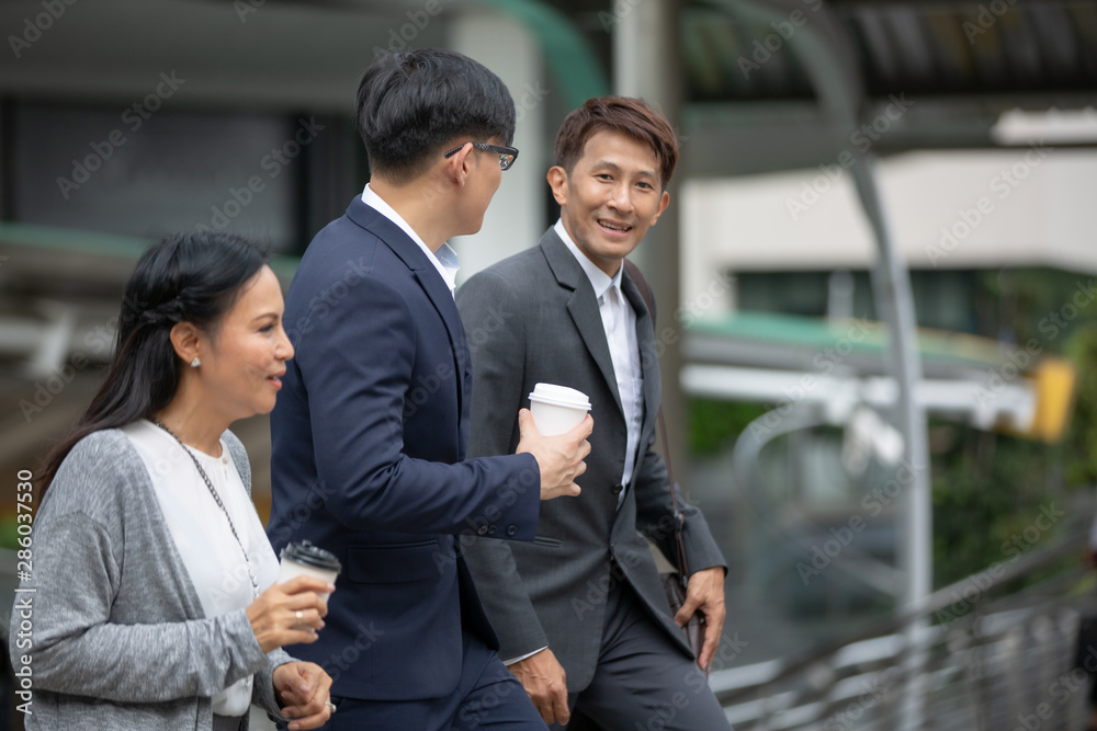 Two businessmen talking at outdoor against building Two businessmen talking at outdoor against building