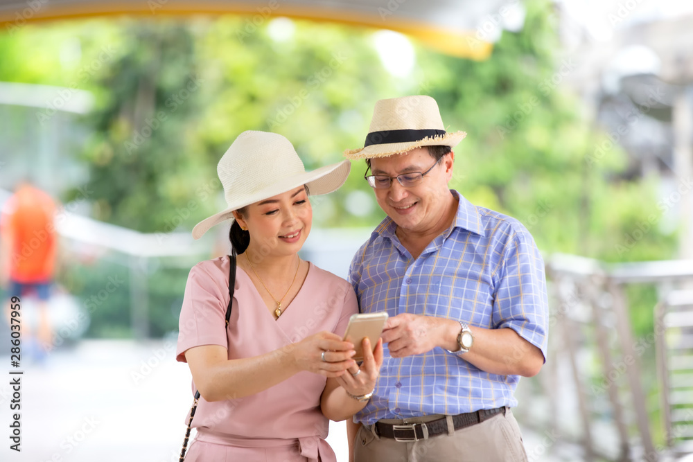 two elderly person going to shopping in city two elderly person going to shopping in city