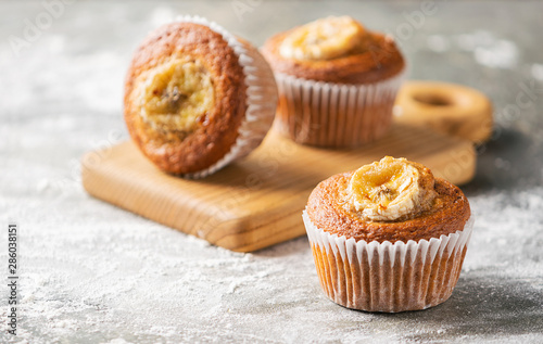 Homemade banana muffins on a gray background. Healthy vegan dessert. Close-up selective focus.