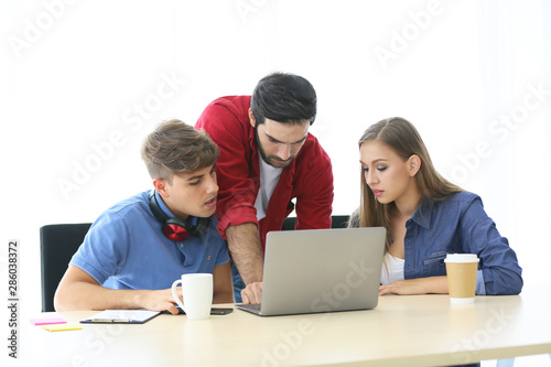 Colleagues discussing strategy during meeting