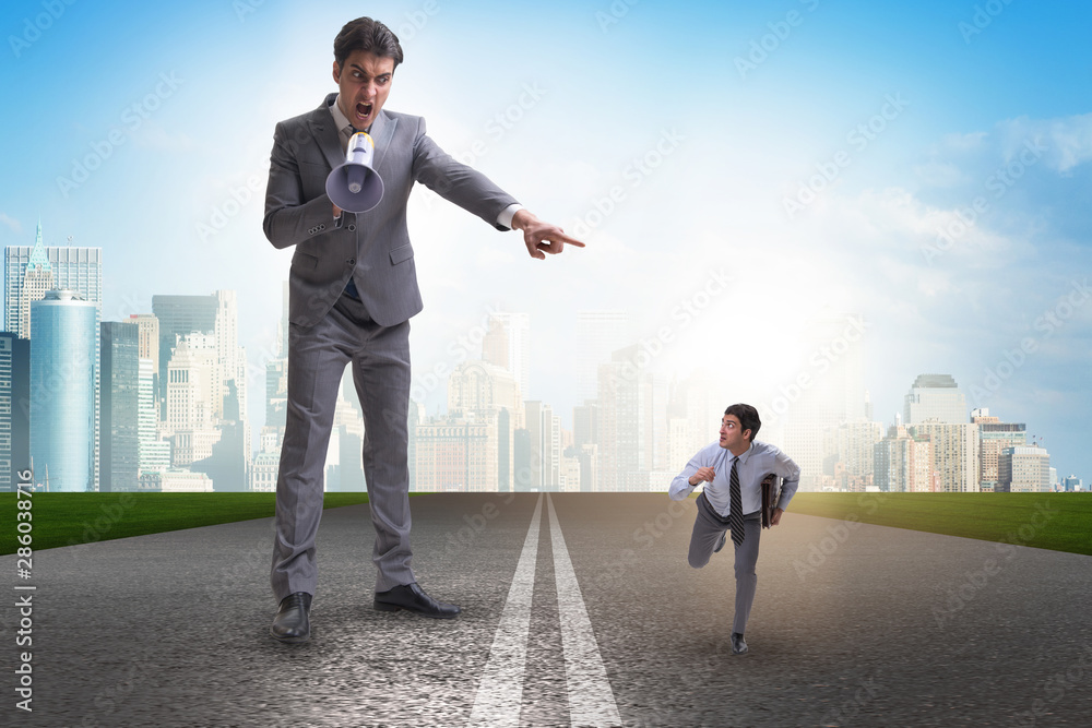 Fototapeta premium Bad angry boss shouting at employee with loudspeaker
