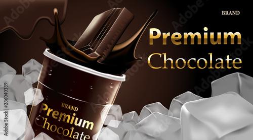 Delicious dark chocolate drink in a clear plastic cup and green straw with splash chocolate on brown color background