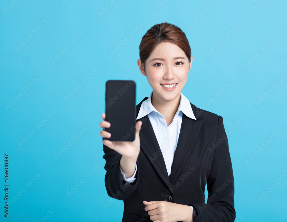 smiling asian business woman showing the smart phone smiling asian business woman showing the smart phone