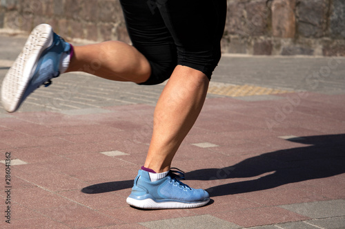 Legs of running woman.