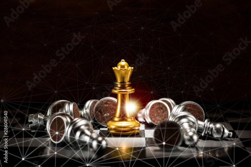 gold queen chess surrounded by a number of fallen silver chess pieces and abstraction connection line network screen , business strategy concept