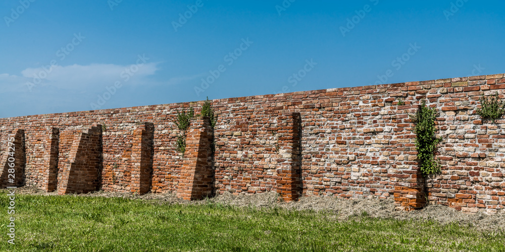 The long monastery wall on the island of Burano