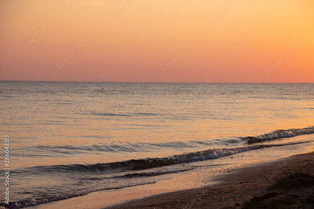 Summer sea at sunset. seascape background. summer evening landscape. sea waves. summer sunset. black sea