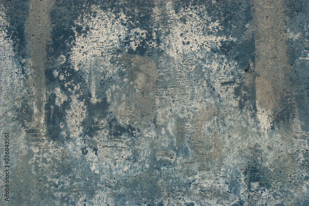 Abstract grunge background. Old cracked concrete with smudges. Gray, blue white colors.