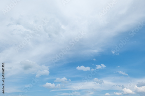 Sky background with fluffy clouds