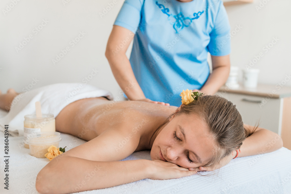 Beautiful young girl having massage at Spa Beautiful young girl having massage at Spa