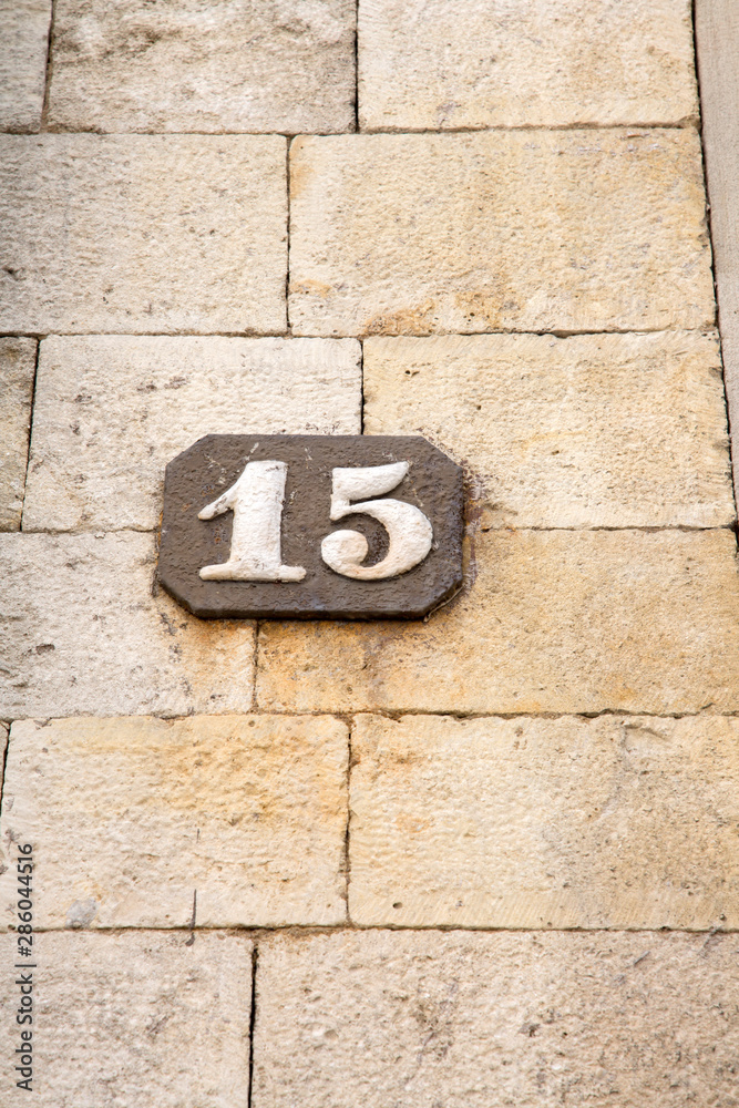 Number Fifteen on Stone Wall Number Fifteen on Stone Wall