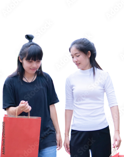 Portrait of Asia girl holding shopping bag on white background