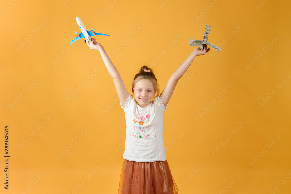 Girl holding airplane and money in her hands, concept of vacation and travel. Girl holding airplane and money in her hands, concept of vacation and travel.