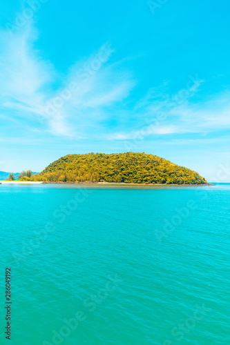 Fototapeta Naklejka Na Ścianę i Meble -  Looking at the Island, blue water and sky.