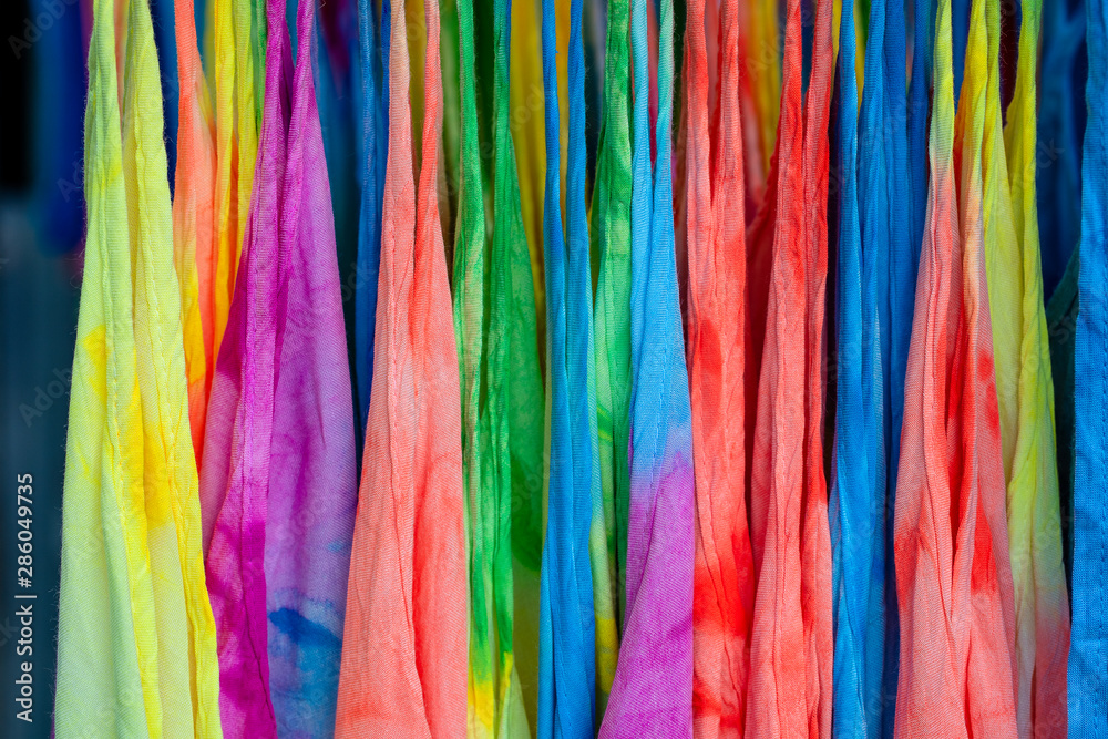 Summer clothes on hangers for sale in local street market in Thailand, close up Summer clothes on hangers for sale in local street market in Thailand, close up