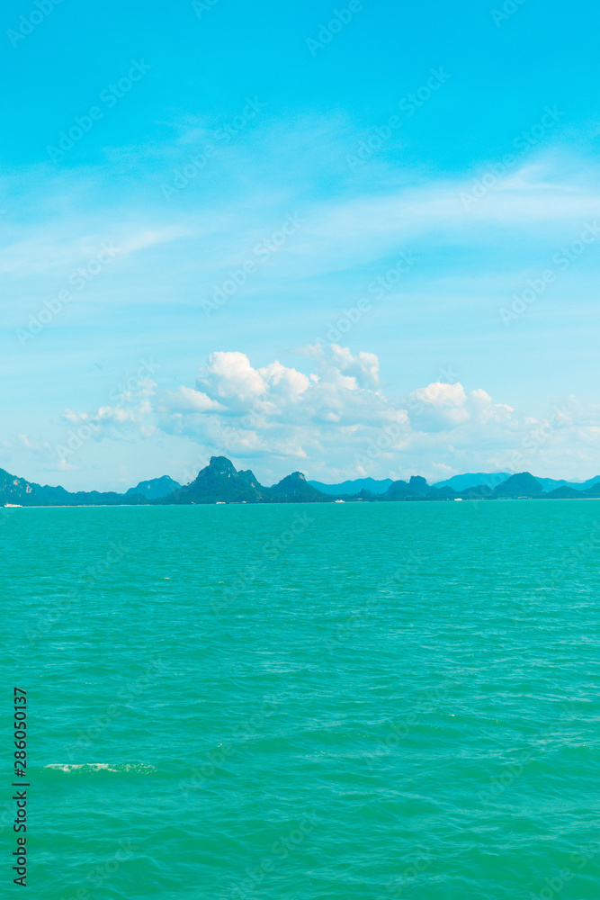 Looking at the Island, blue water and sky. Looking at the Island, blue water and sky.