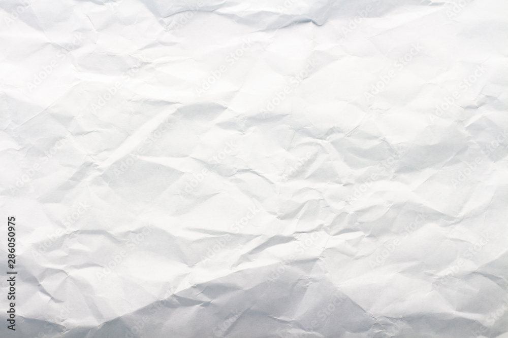 Crumpled white paper. Texture. Can be used as background or wallpaper. Flat lay, top view