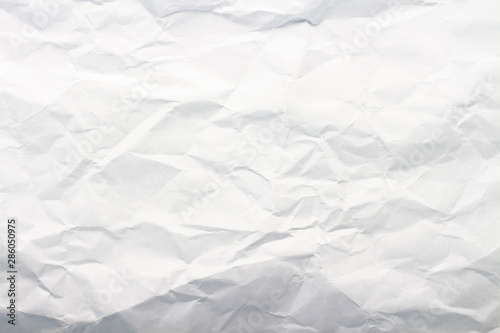 Crumpled white paper. Texture. Can be used as background or wallpaper. Flat lay, top view